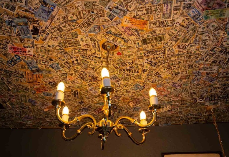 Punters pay tribute to a murdered soldier by sticking money on the ceiling